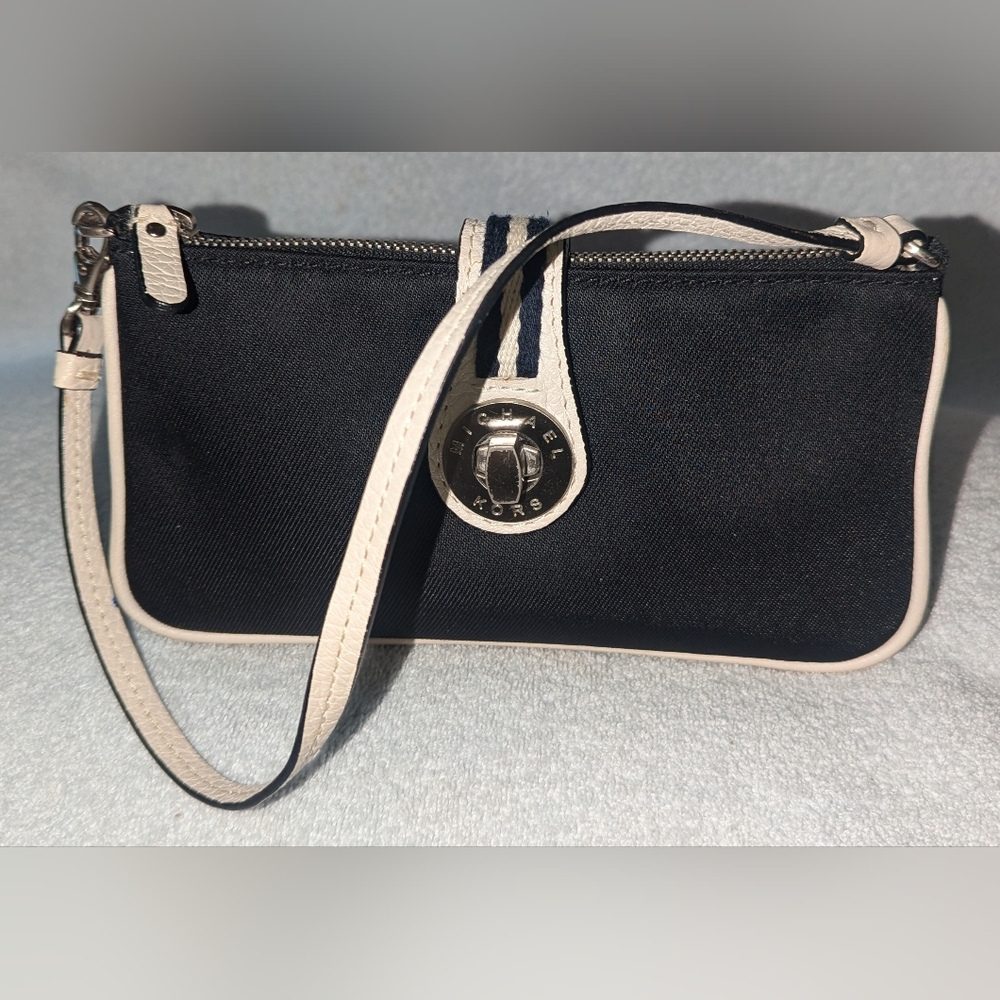 Michael Kors black canvas with cream leather trim and handle.